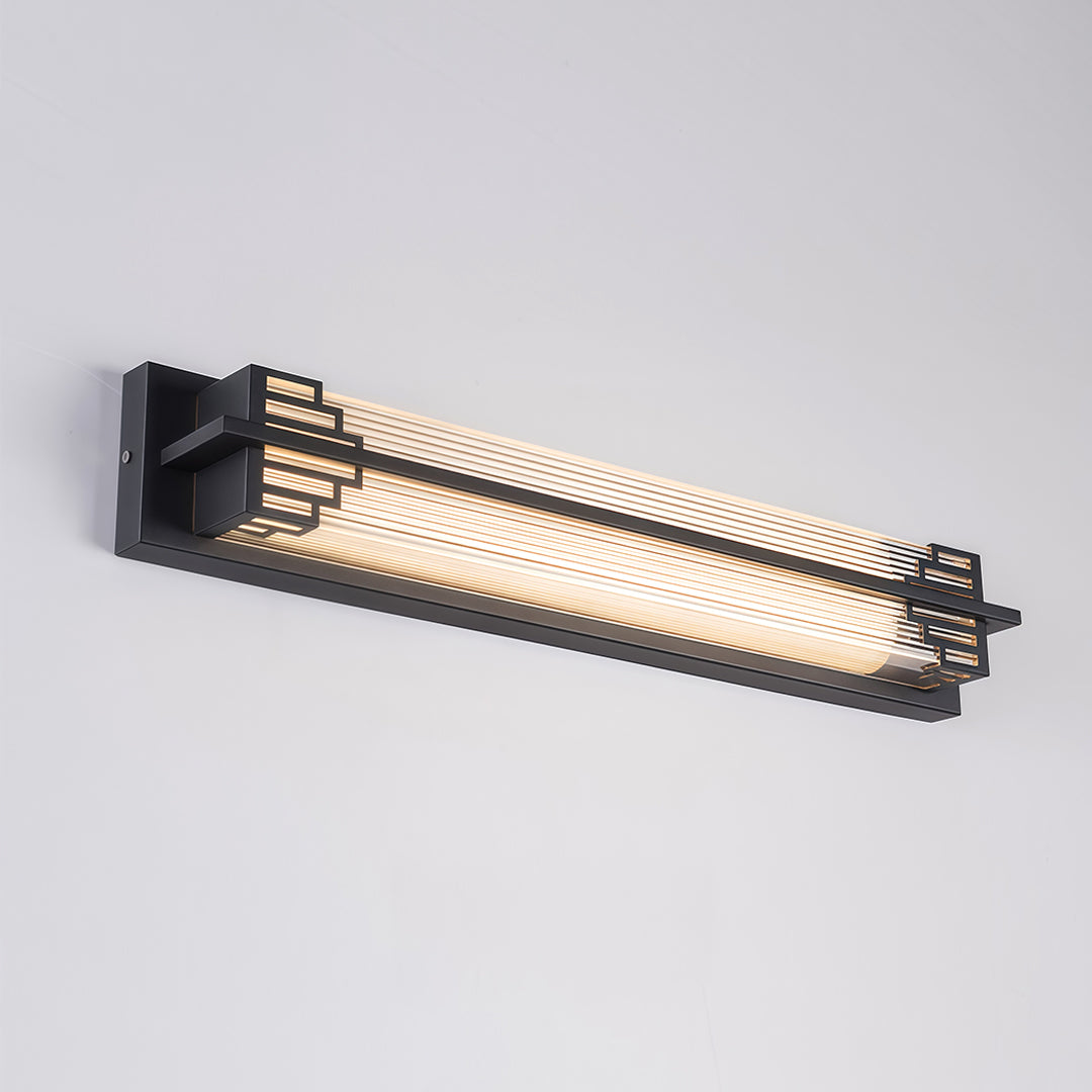 Outdoor wall mounted LED lights with a modern look, installed along a driveway to light up the path.