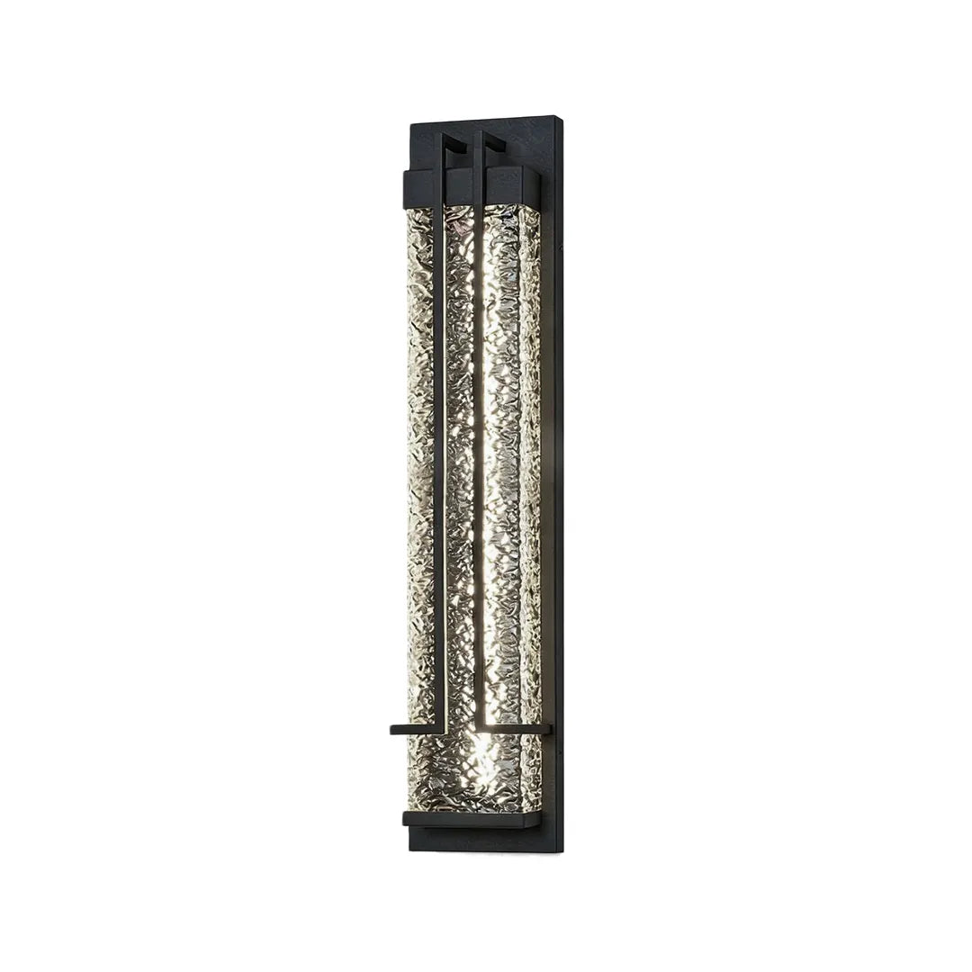 Modern outdoor wall sconce with black frame and warm illuminated glass