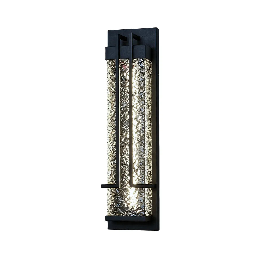 Modern outdoor wall sconce with black metal frame and clear textured glass