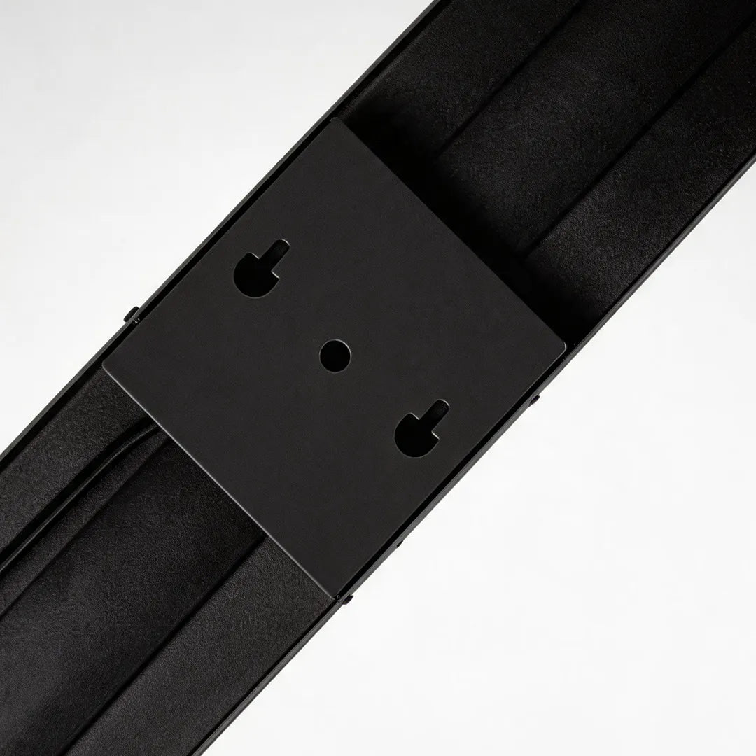 Modern outdoor wall sconce with black metal mounting bracket detail