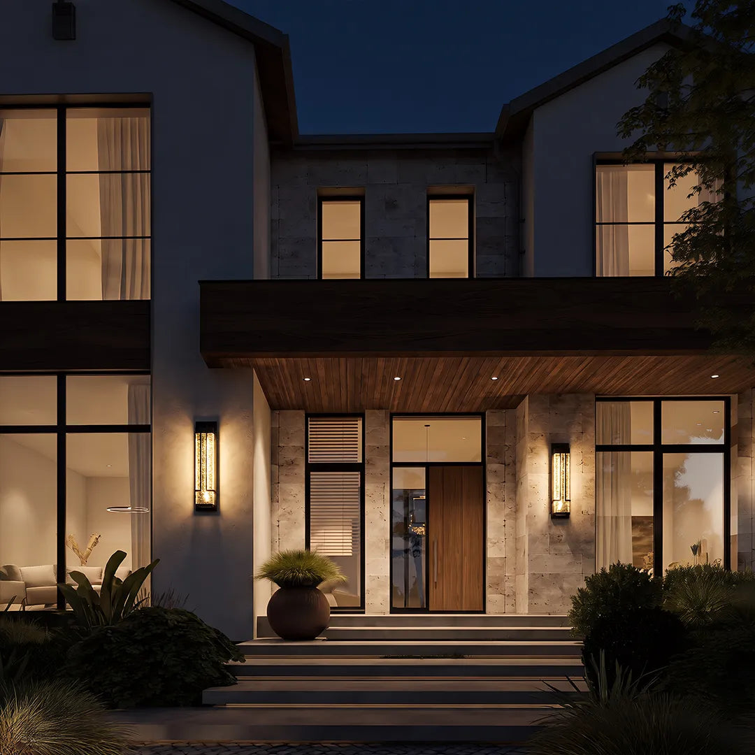 Modern outdoor wall sconces with warm lighting beside contemporary home entrance