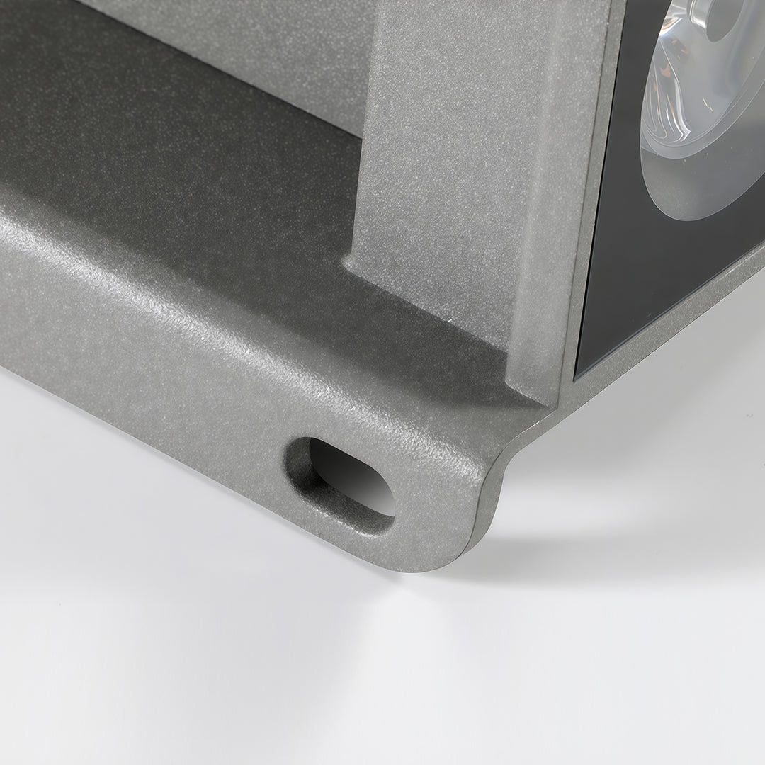 Outdoor wall wash lights installed on modern home entrance at dusk.