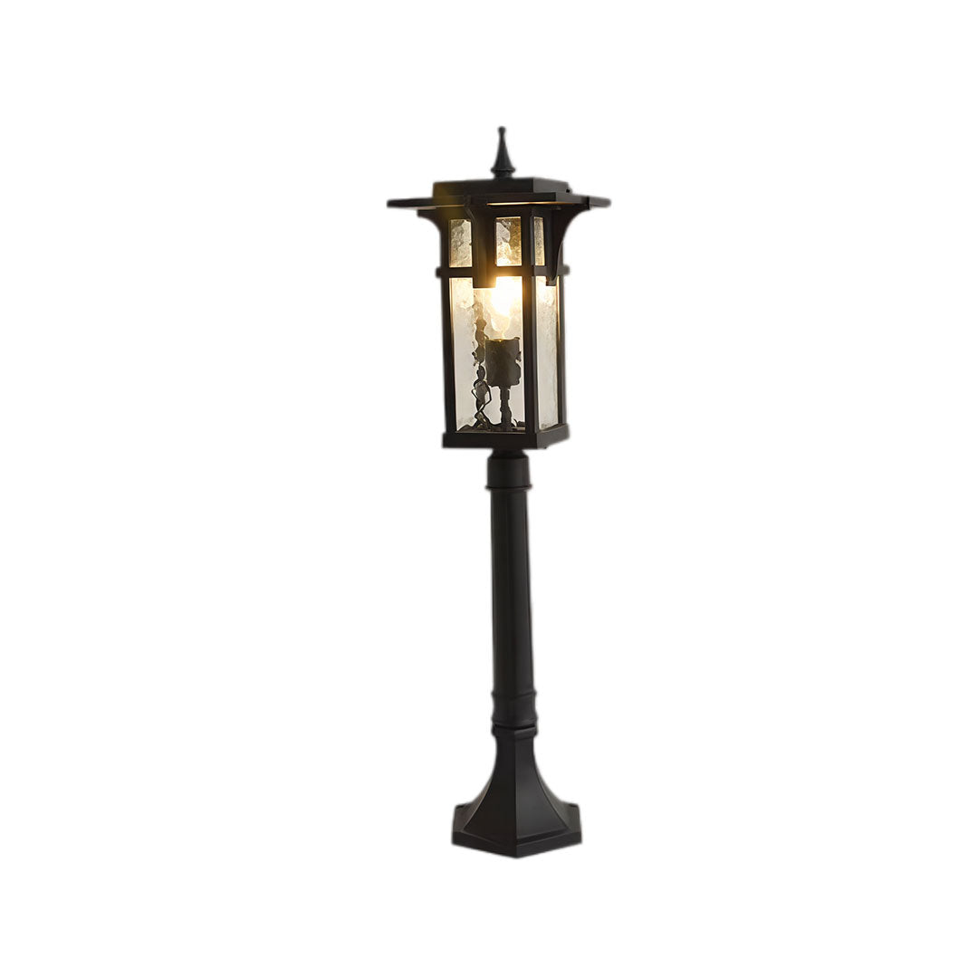 Modern path light with black metal frame and clear glass panels, displayed from a side angle.