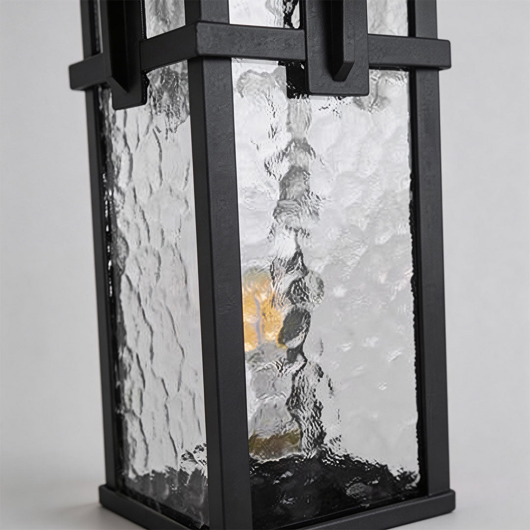 Modern path light with frosted glass panels and black metal frame for a sleek outdoor look.