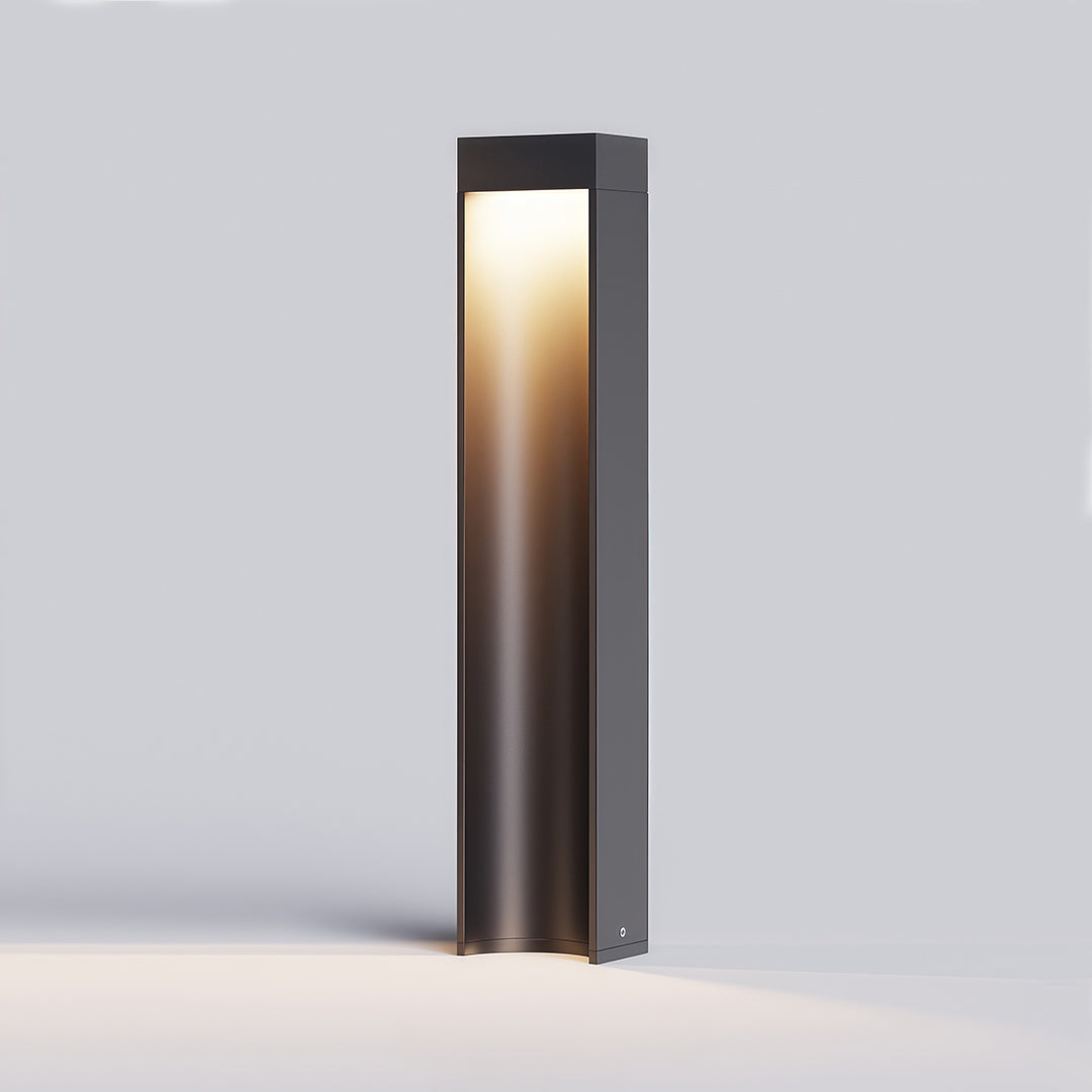 Modern path light stake with a sleek black rectangular design and warm light, perfect for garden pathways.