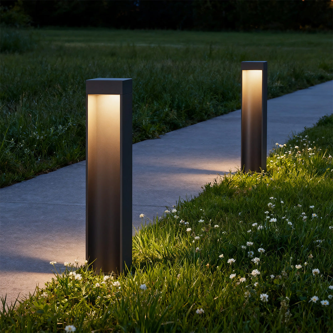 Modern path light stake with a tall black rectangular design, ideal for landscape lighting.