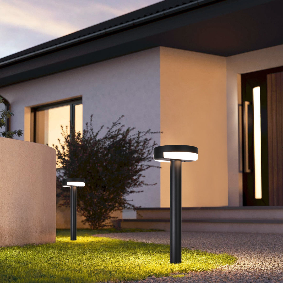 Modern pathway lighting illuminating residential entrance at night with warm downlight creating welcoming ambiance