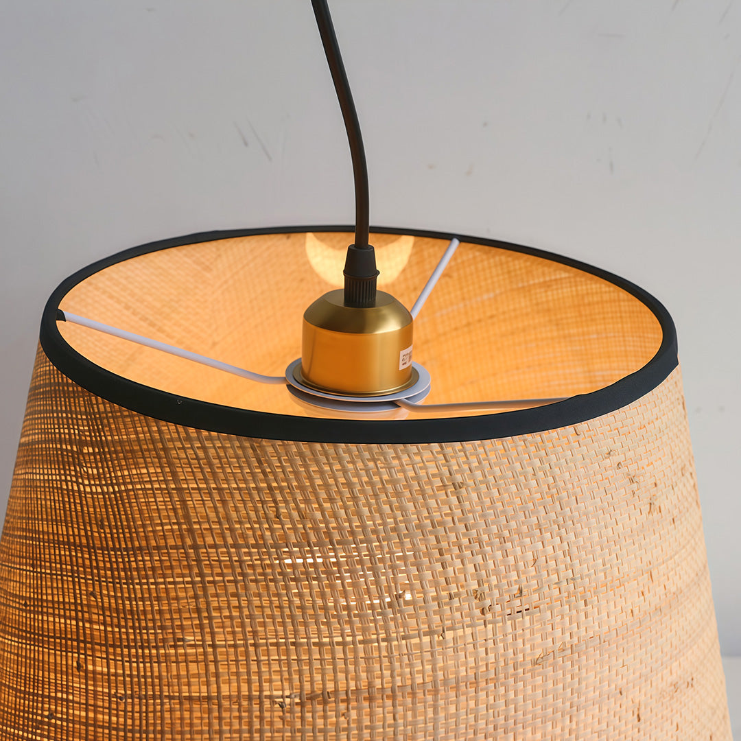 Modern pendant fabric light shade hanging above a table in a bright and airy living space.