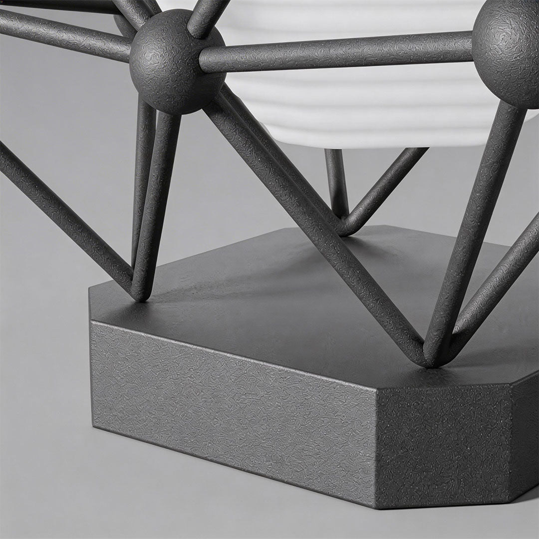 Close-up of a modern pillar light for garden with a geometric design and warm glow.
