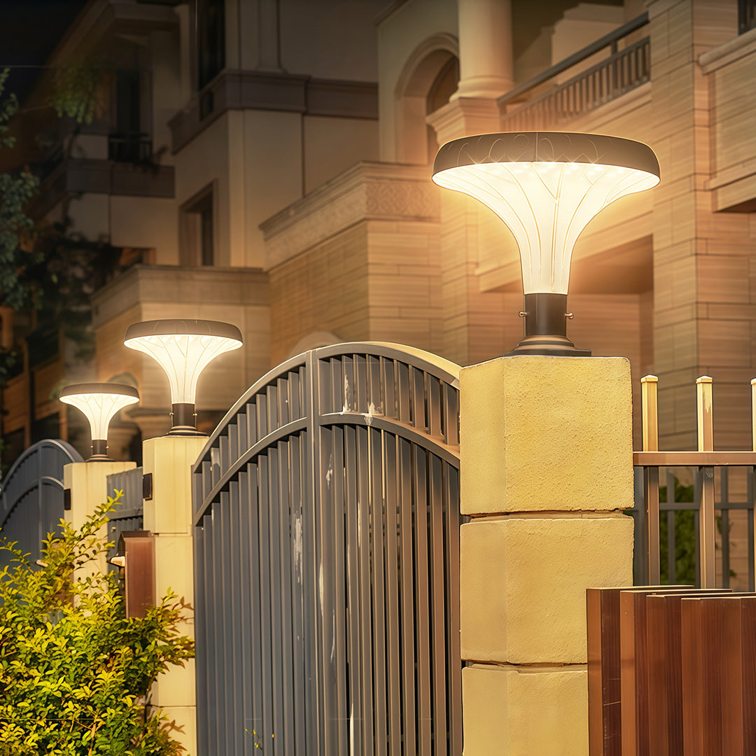 Modern pillar light in front of a house, creating a stylish and bright entrance.