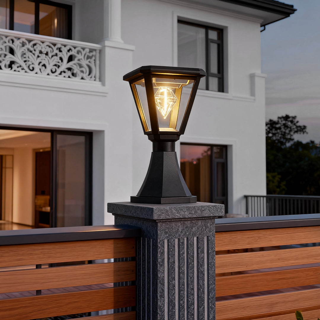 Contemporary concrete post topped with elegant led post cap lights, enhancing the entrance of a modern house.