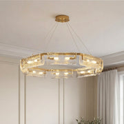 Modern rectangular glass chandelier with textured ice glass panels and a sleek gold frame.