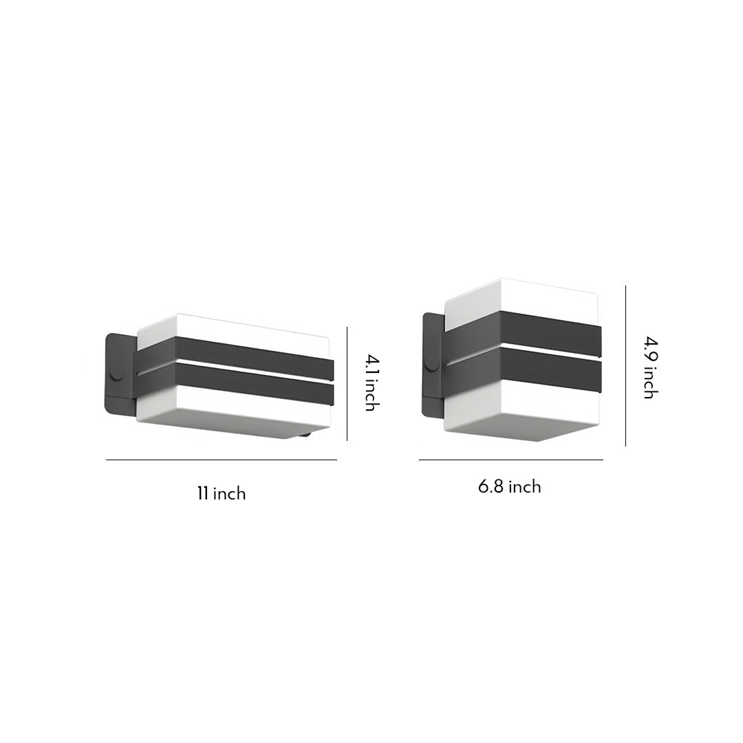 Modern black-and-white rectangular outdoor wall sconce lighting fixture with clean geometric lines.