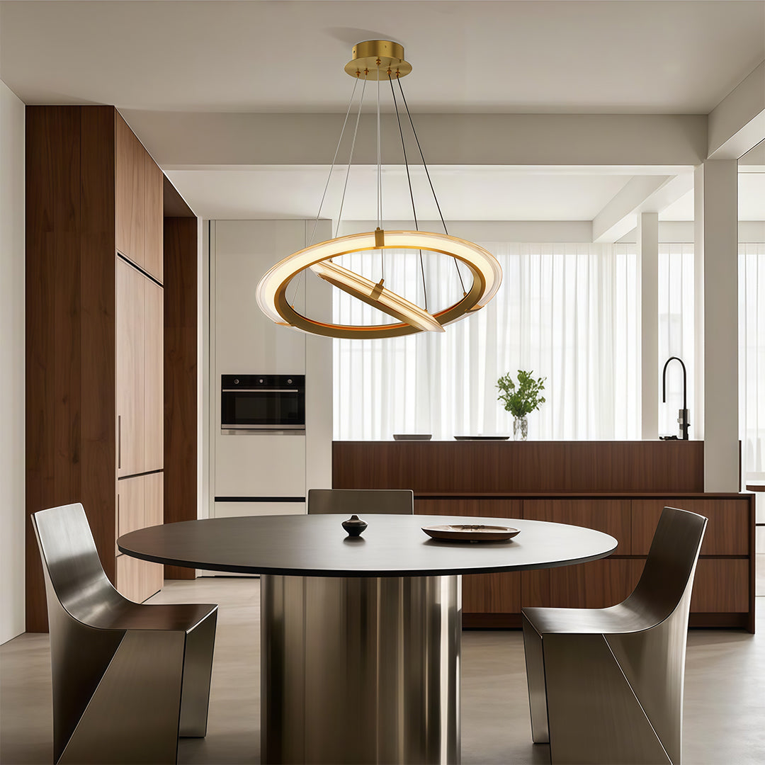 Contemporary dining room with three-tier modern round chandelier in warm gold finish.