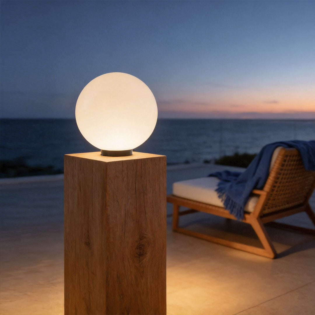 Modern round landscape lighting on a tall wood pillar with sunset and ocean view background!!