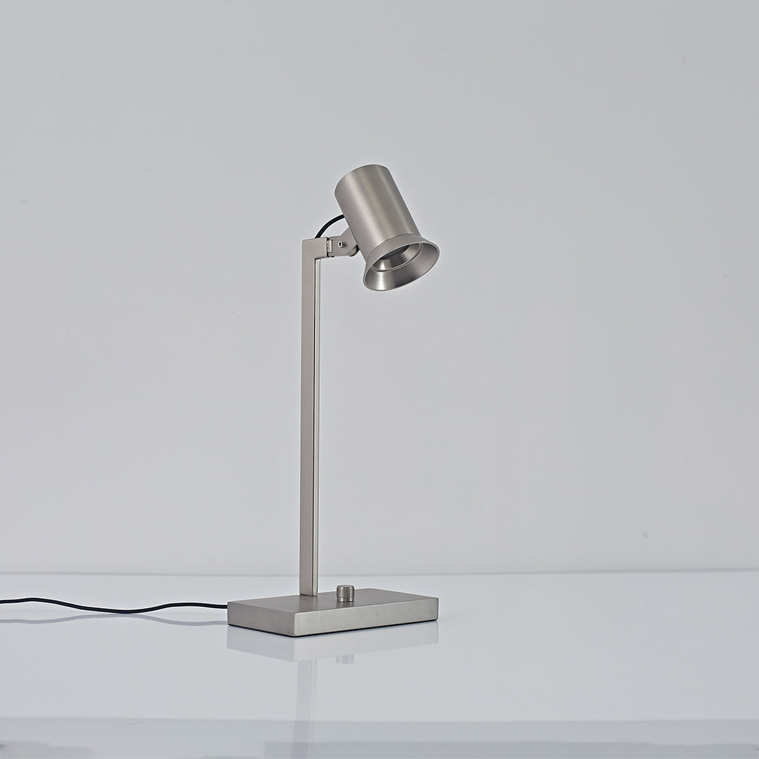Modern swing arm desk lamp in satin nickel finish with minimalist design.