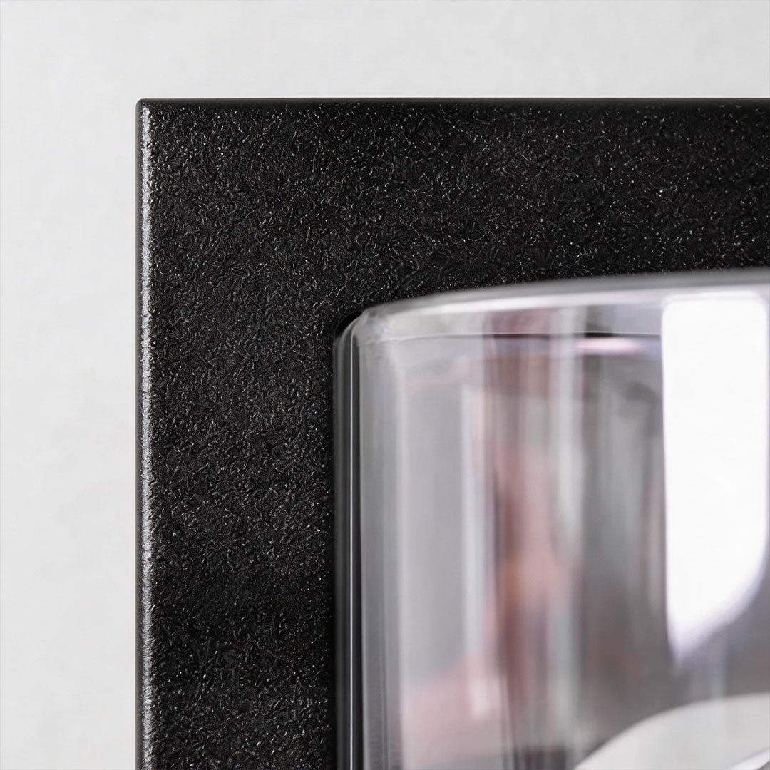 Close-up of modern sconces outdoor showcasing its glass panel and warm light.