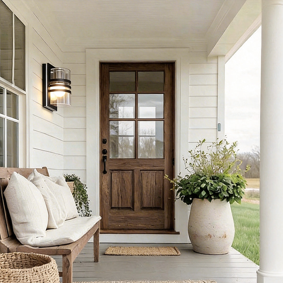 Modern sconces outdoor with a contemporary design, illuminating a wooden front door.