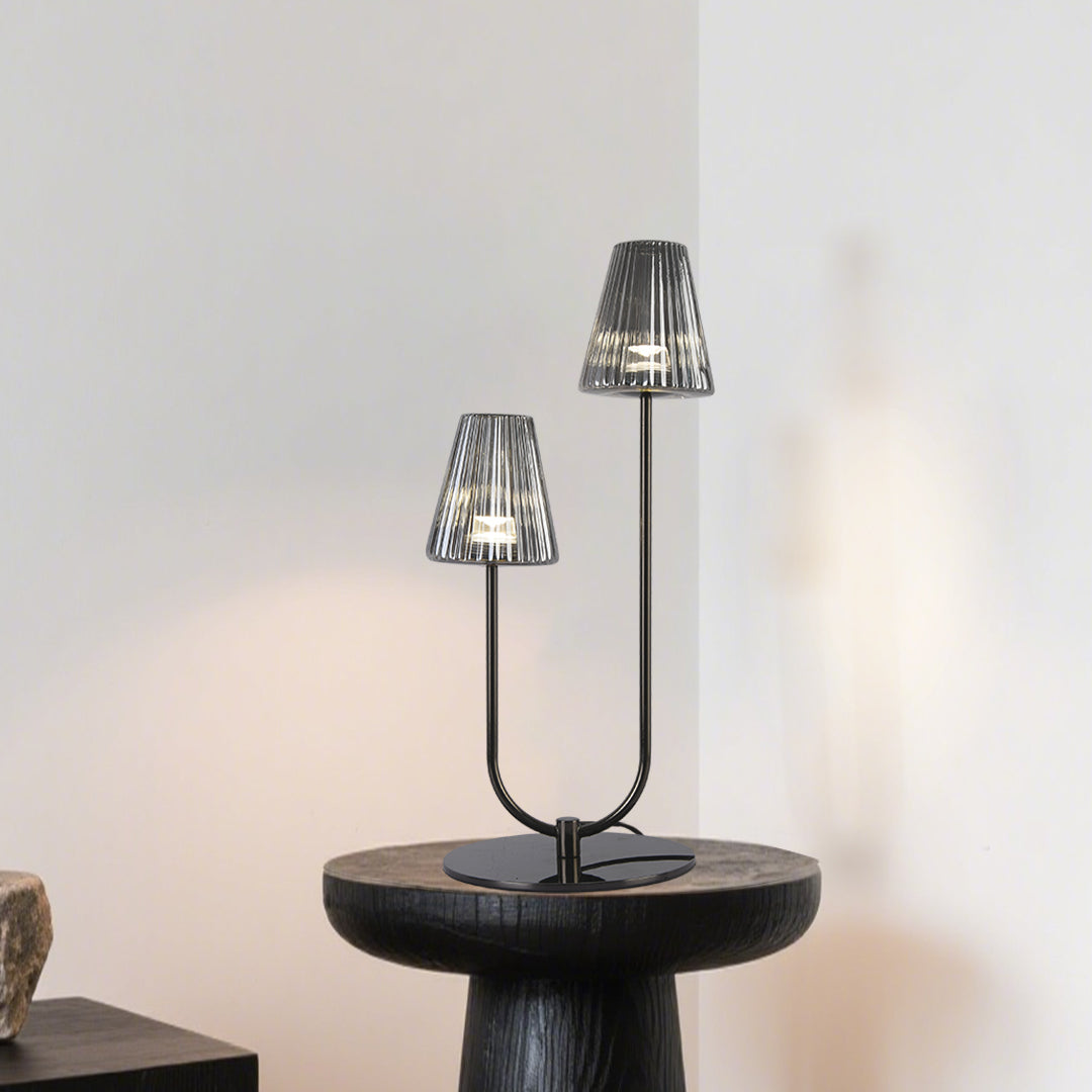 Modern table lamp with sculptural design illuminating contemporary living room side table