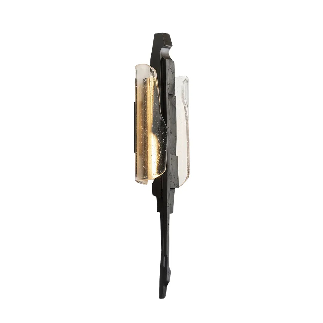 Modern sculptural wall sconce product image showing a side view with black frame, amber glass, and clear accent panel.