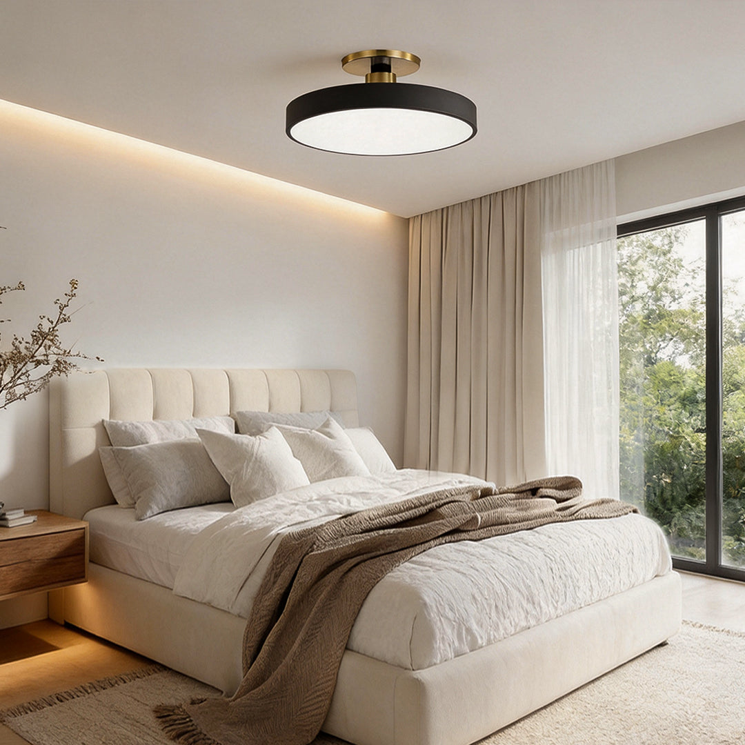 Modern semi flush mount ceiling lights illuminating a cozy bedroom with warm, ambient glow.