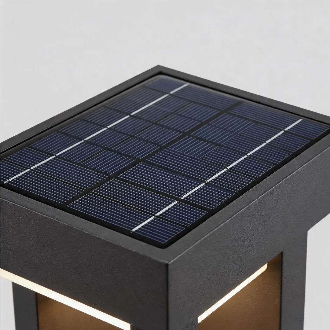Modern solar bollard light with integrated square solar panel and black metal frame