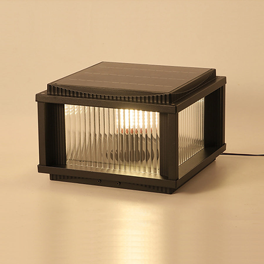 Modern solar outdoor pillar light studio shot displaying compact design and warm LED lighting capabilities