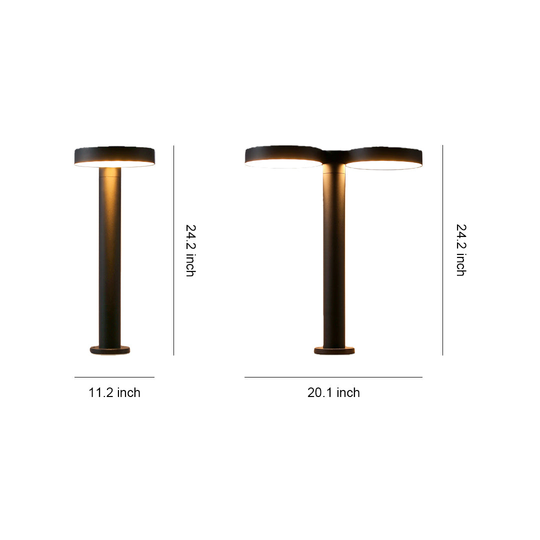 Modern solar path light with a sleek design, illuminating a garden path during the night.