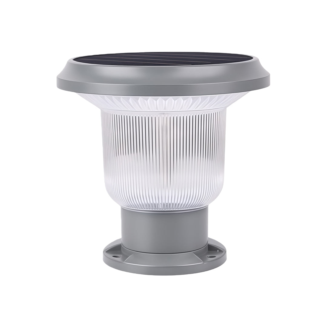 Modern solar pillar light illuminating a gate and surrounding area, enhancing the outdoor ambiance.