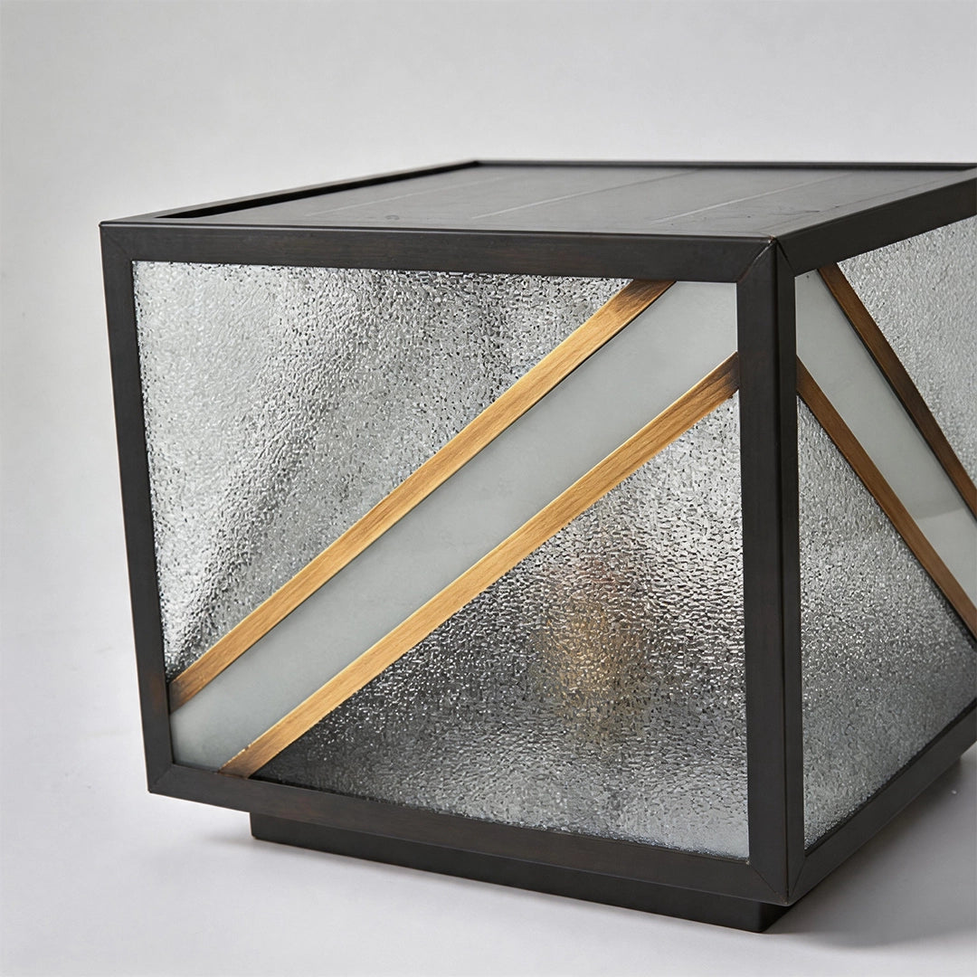 Modern solar pillar light with black frame textured glass and diagonal gold accents