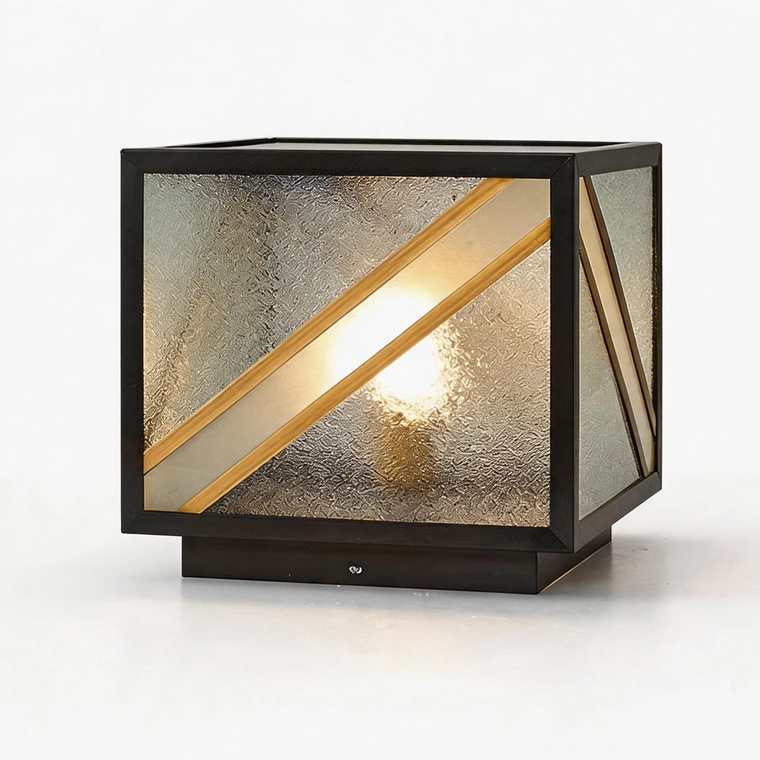 Modern solar pillar light with textured glass diagonal gold bars and warm glow