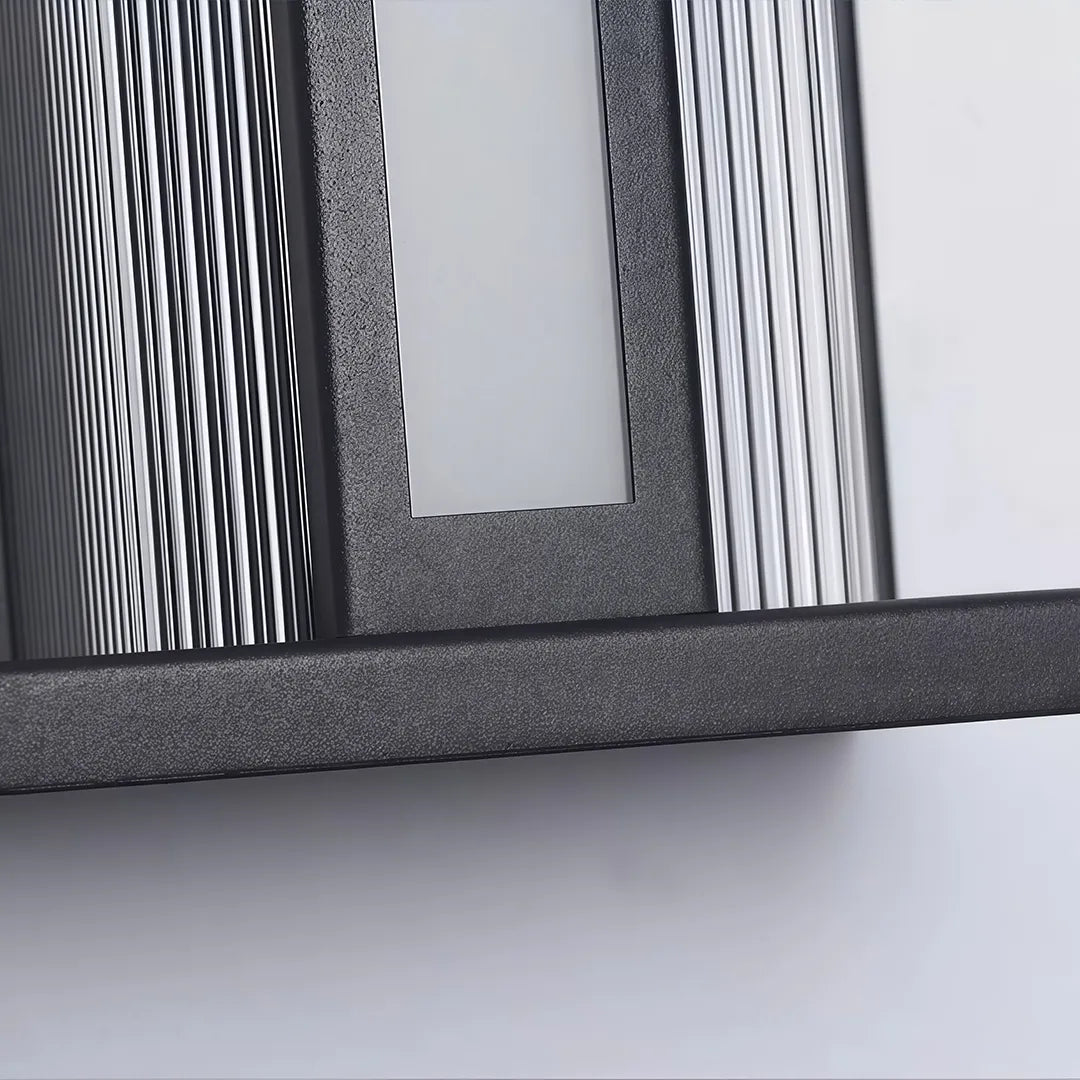 Modern solar wall sconce with textured black frame and white LED diffuser