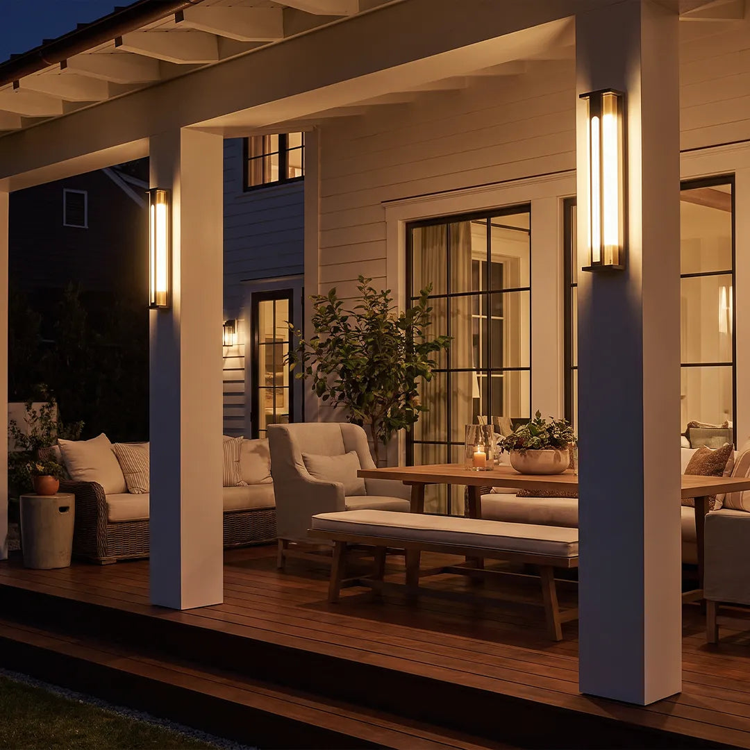 Modern solar wall sconces illuminating covered porch and outdoor seating