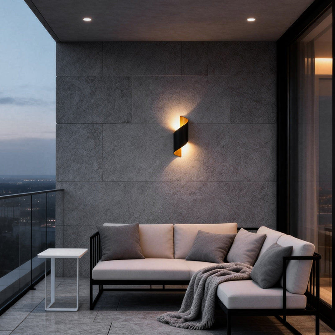 Modern spiral wall light illuminating a cozy balcony with warm, ambient glow.