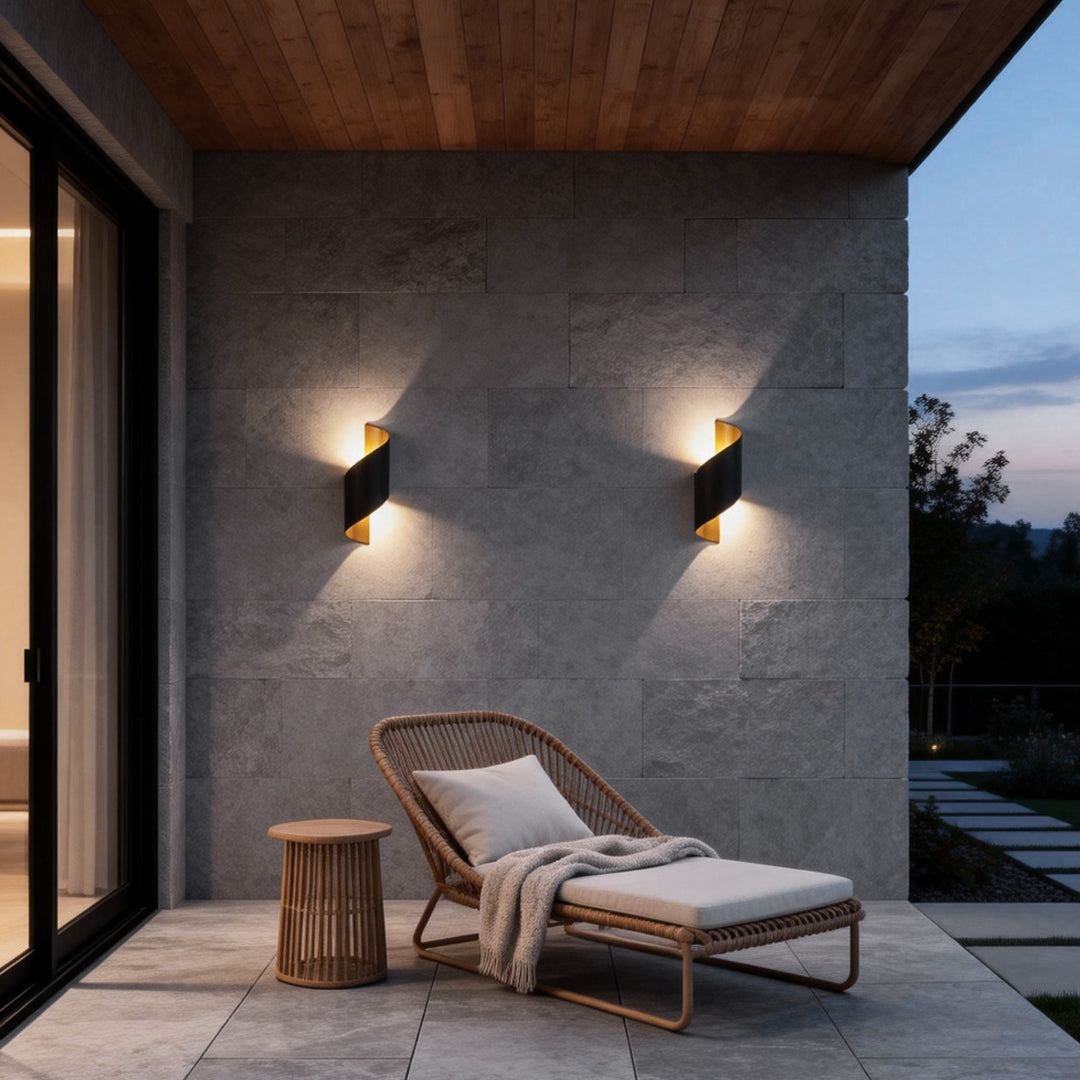 Modern spiral wall light providing soft illumination for an outdoor patio.