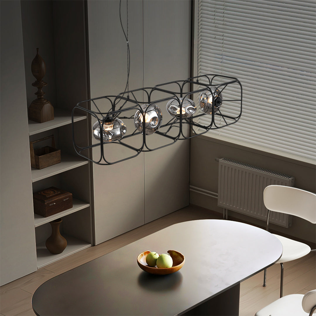 Square cage chandelier hanging in industrial-modern dining room with concrete wall features