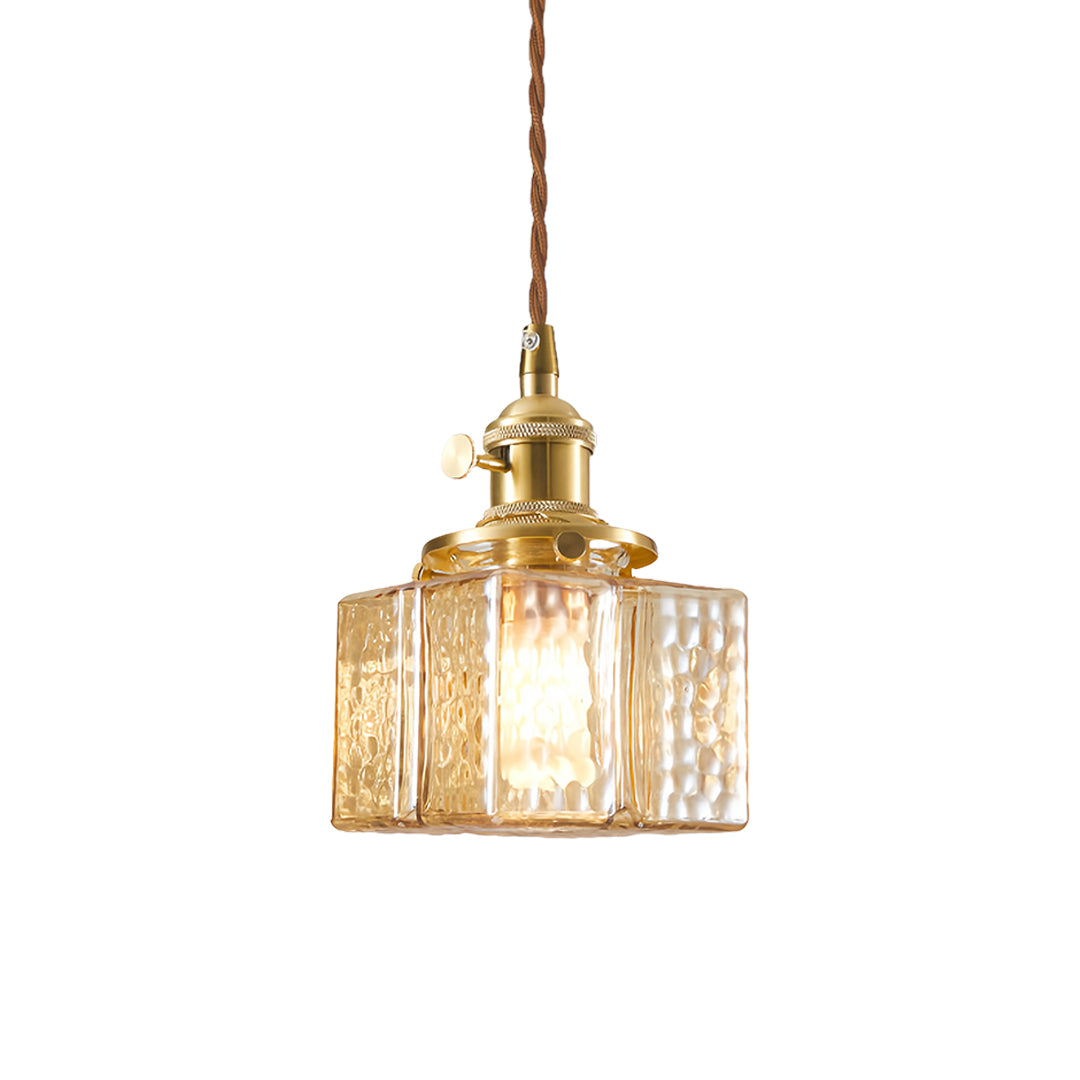 Modern square glass pendant light featuring ribbed glass design and gold hardware for contemporary decor
