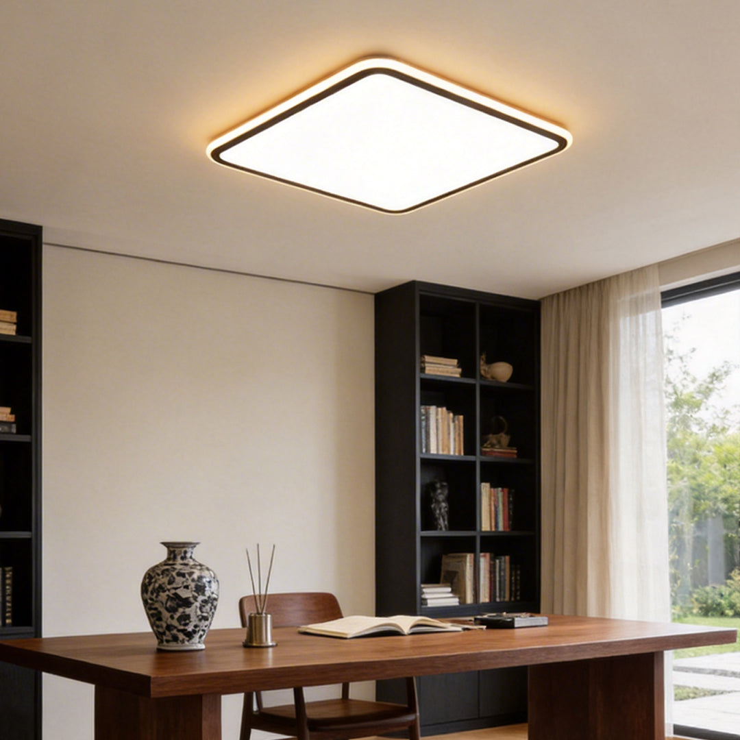 Modern square LED ceiling light providing bright illumination in a contemporary home office.