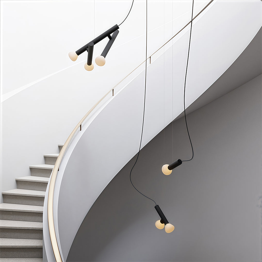 Black small pendant light in a modern staircase area, stylish and functional lighting solution