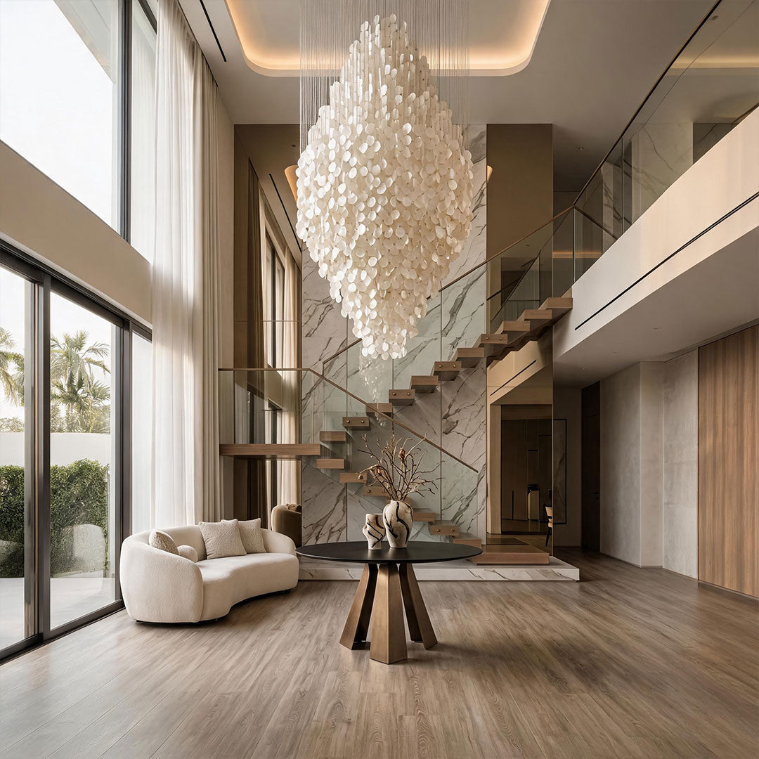 Modern staircase chandelier creating a dramatic focal point beside a contemporary staircase.