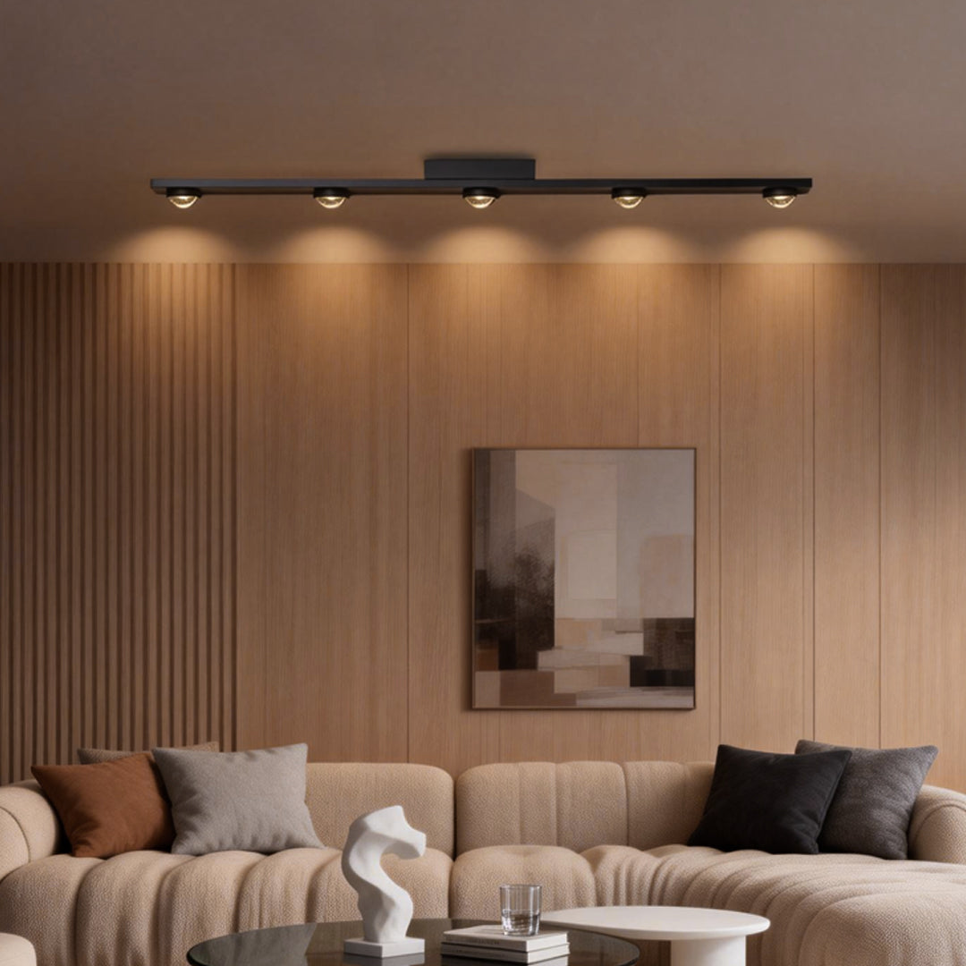 Modern surface mounted spot light in a minimalist setting, ideal for creating a clean and stylish ambiance in any space.