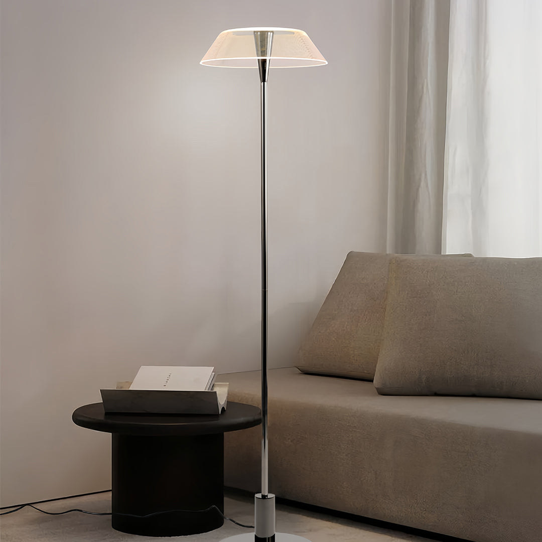 Contemporary floor lamp with a white translucent shade in a modern living room