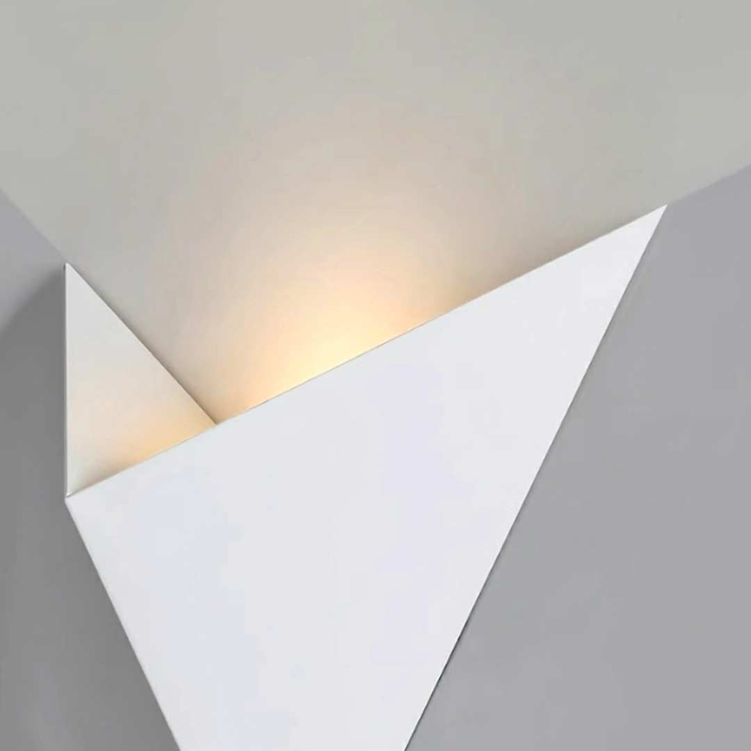 Modern triangle wall sconce with technical view of the backplate and wiring.