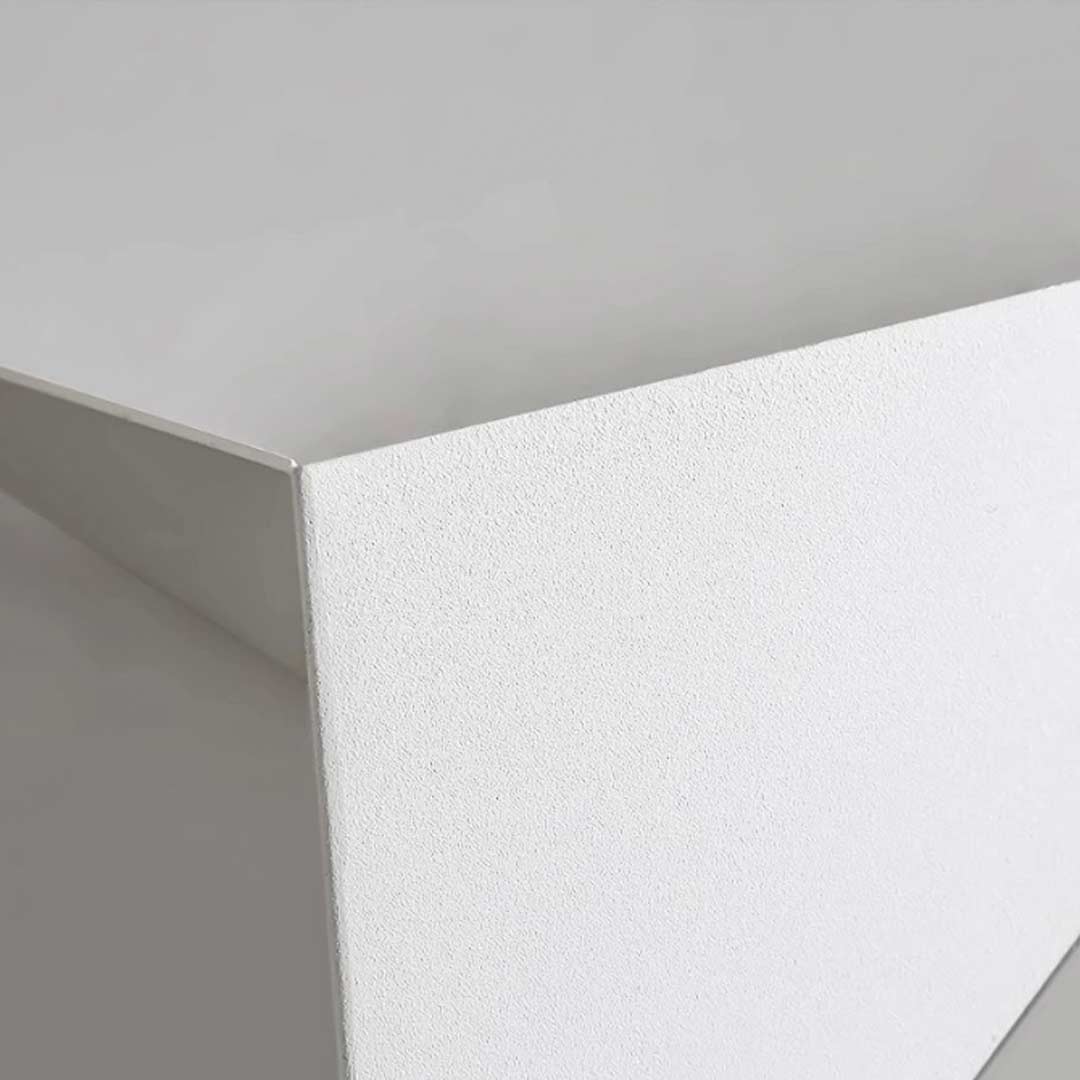 Modern triangle wall sconce with close-up of the light source and diffusion.