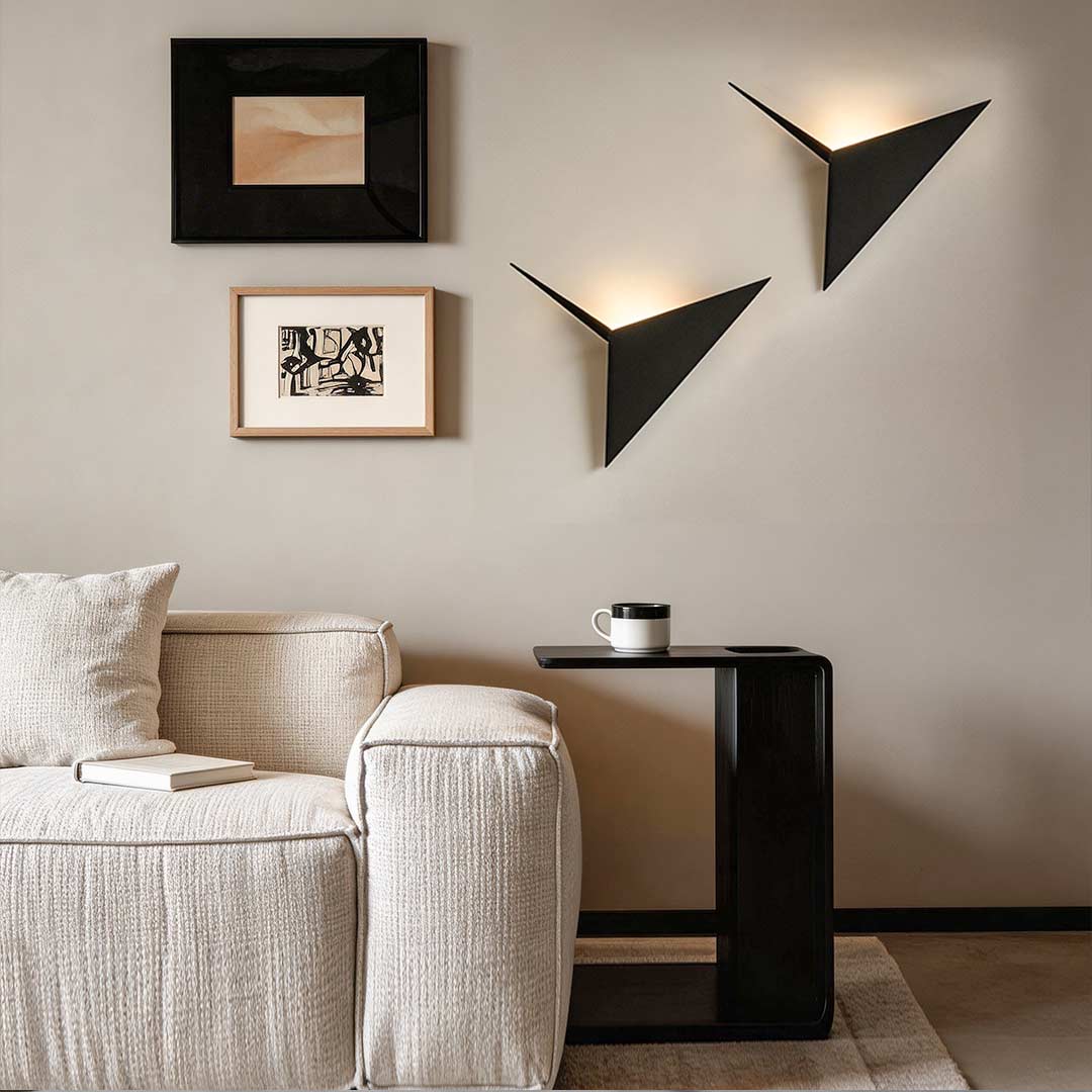 Modern triangle wall sconce enhancing a contemporary living room with elegant ambient light.