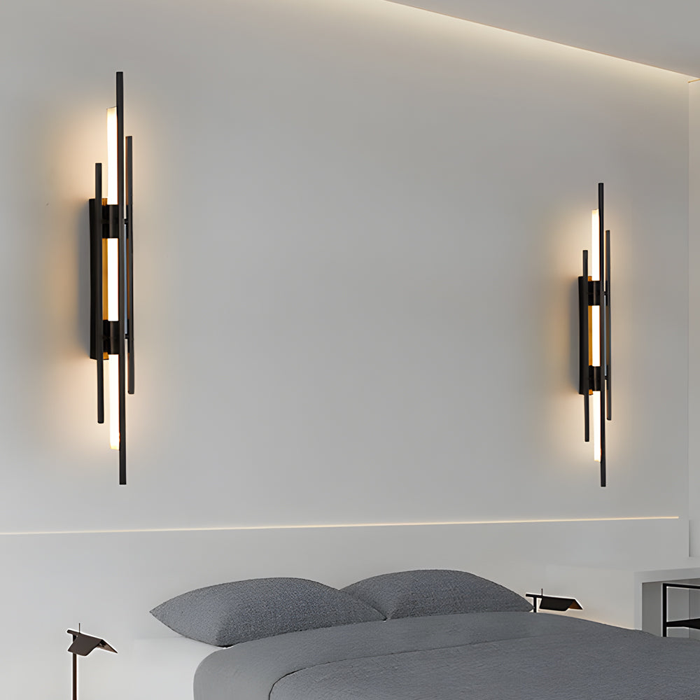 Modern tube wall sconce with black frame and warm LED light.