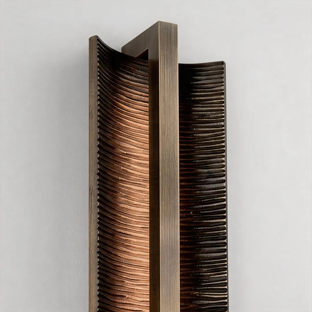 Modern vertical wall sconce with ribbed metal shade and warm LED glow