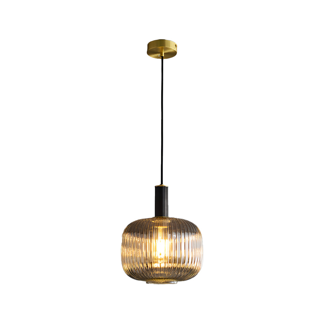Modern vintage glass pendant light fixture with a wide ribbed shade isolated on a white studio.