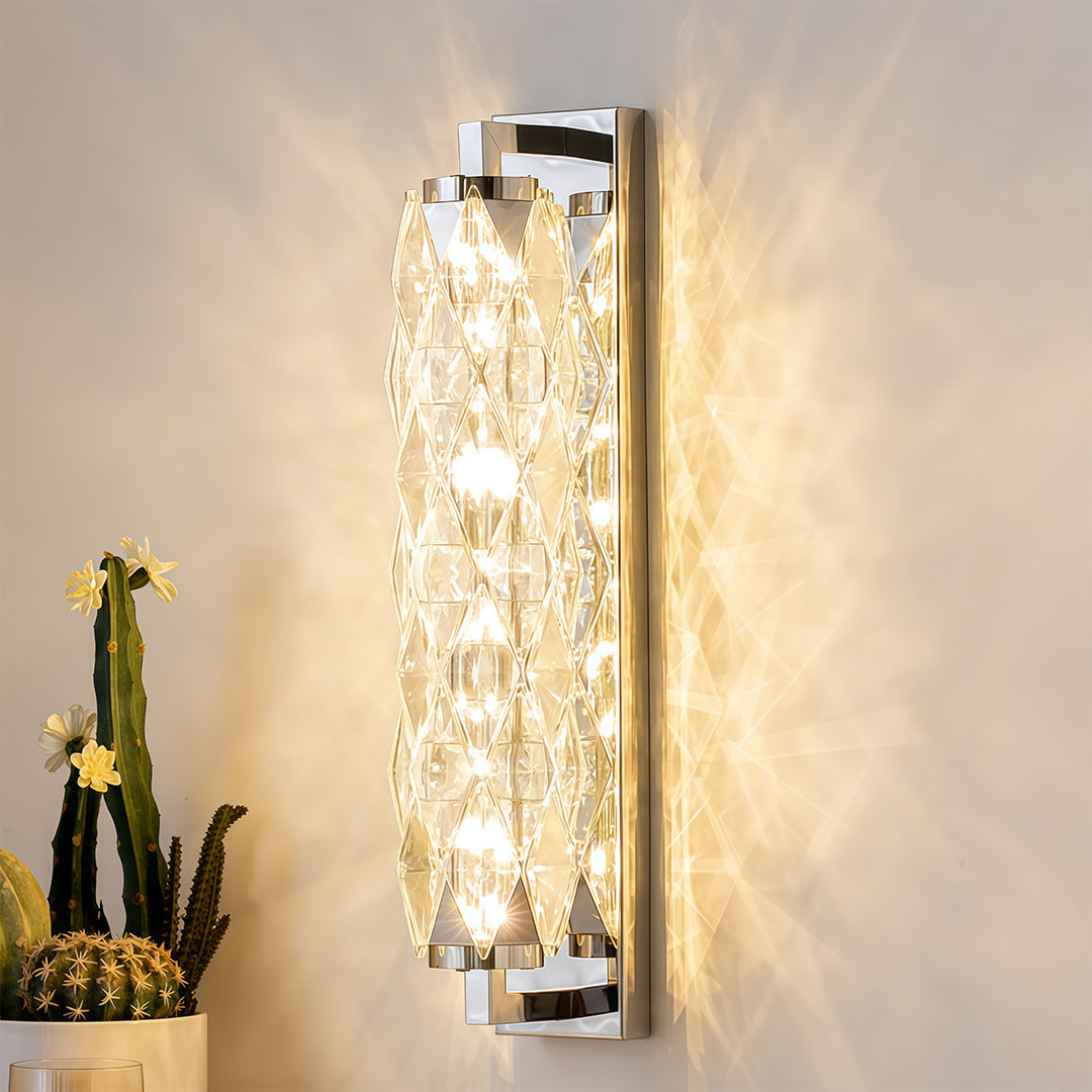 Modern wall light brightening dark textured wall beside plant and contemporary decor at dusk.