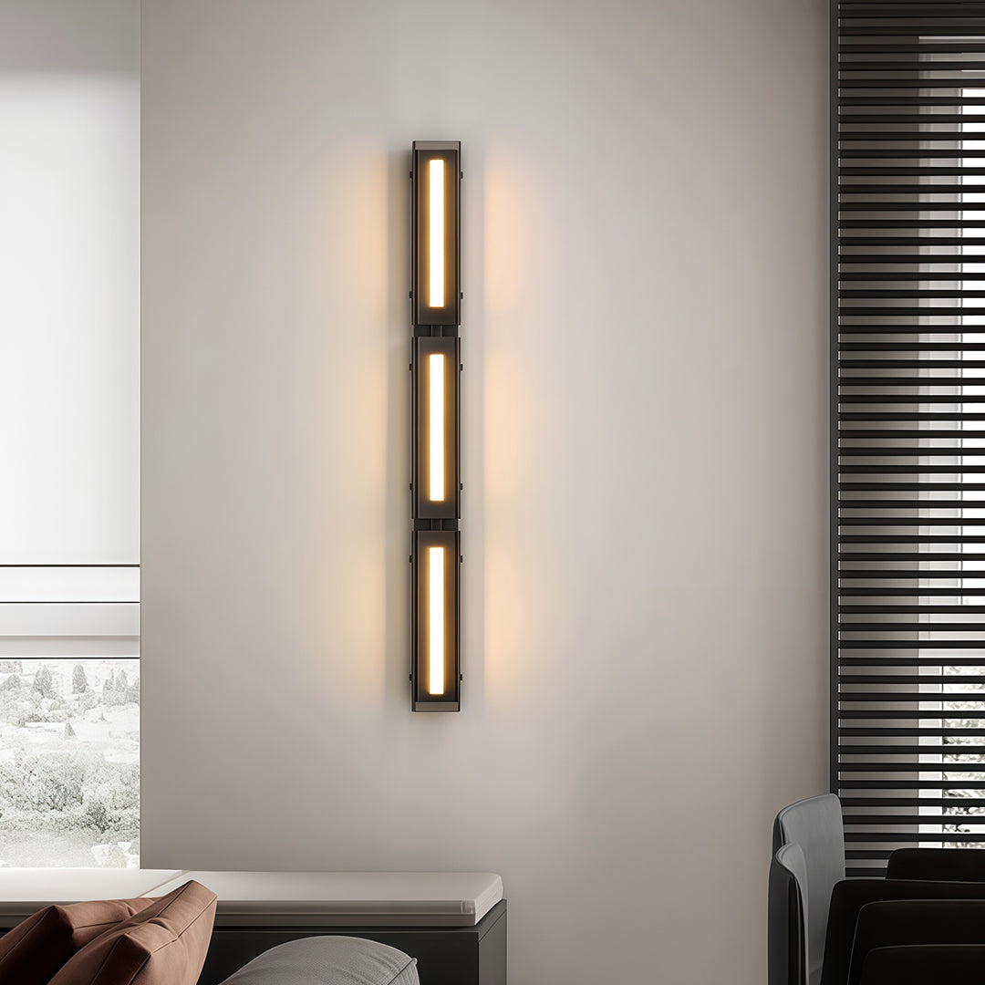 Modern wall light decoration mounted beside a bed, adding a contemporary touch to the room.